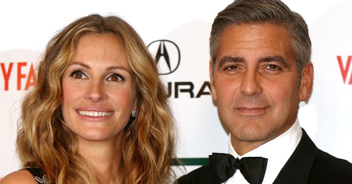 Julia Roberts made a splash at an event in honor of George Clooney in a dress with actor’s face images all over it